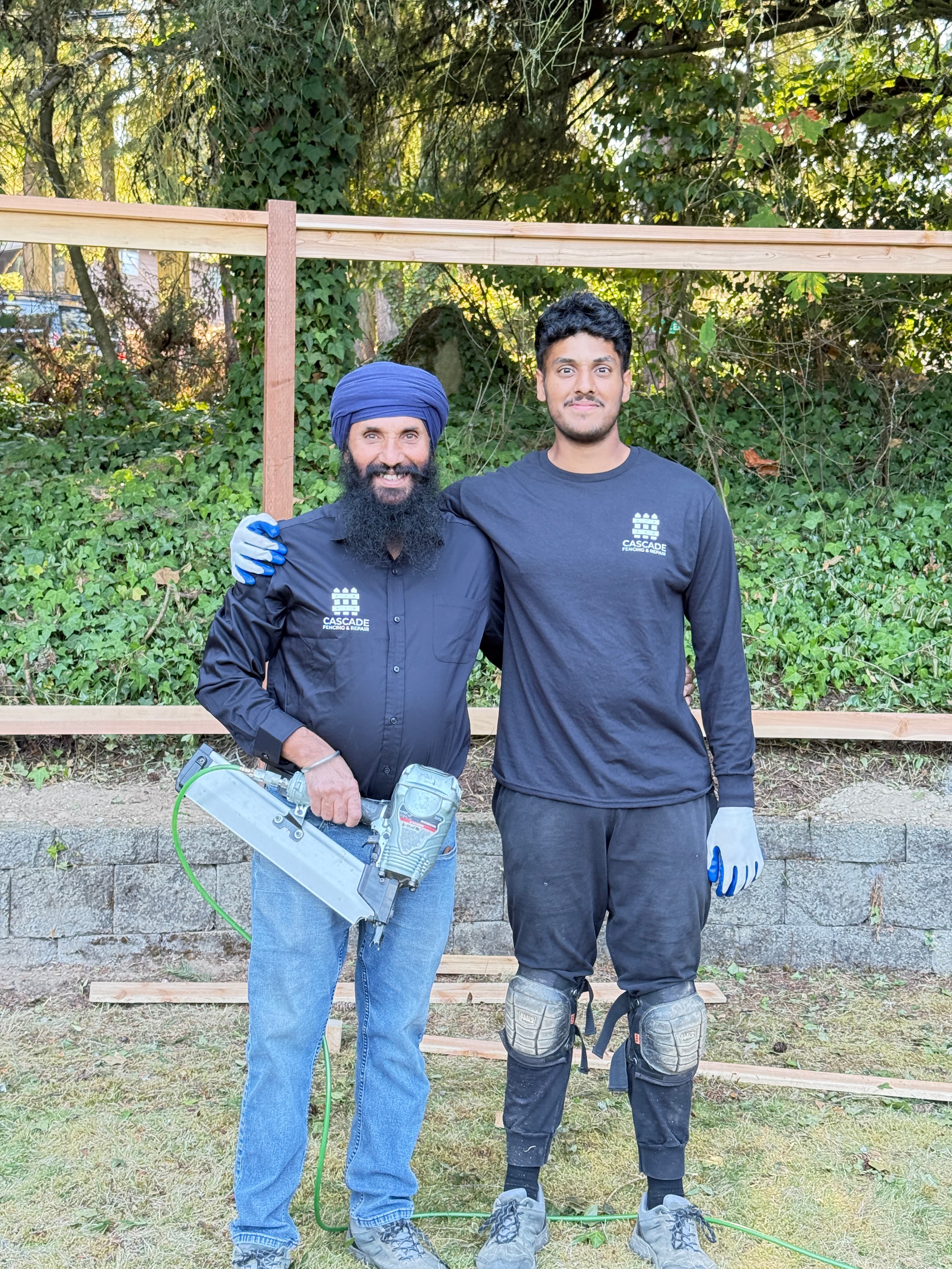 Cascade Fencing team - Rubin Singh and Bal Singh on job site in Sumner, WA